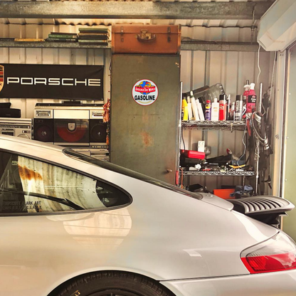 Around The World Gasoline Round Metal Sign