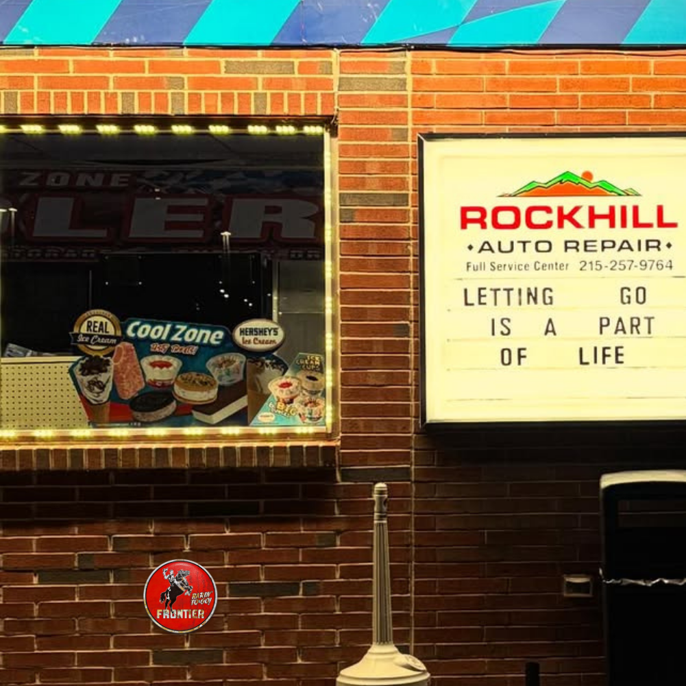 Frontier Gasoline “Rarin’ To-Go!” Round Metal Sign