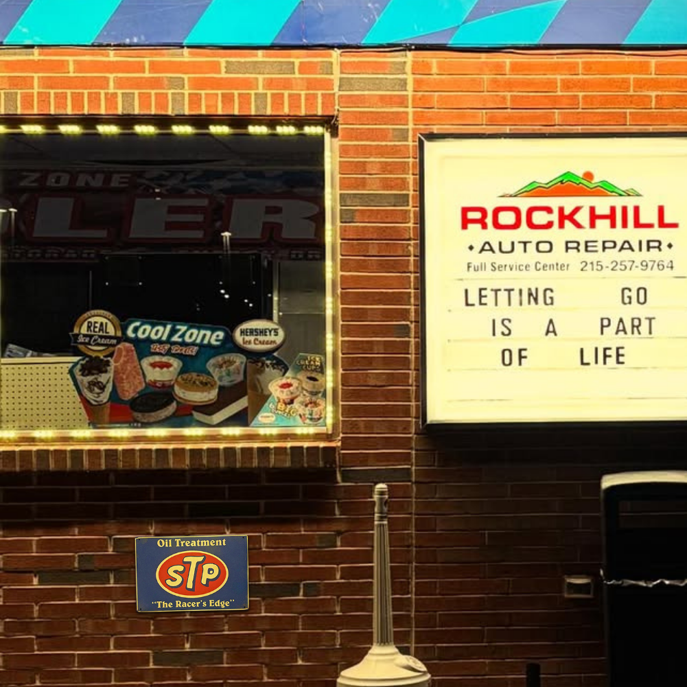 STP Oil Treatment – “The Racer’s Edge” Tin Sign